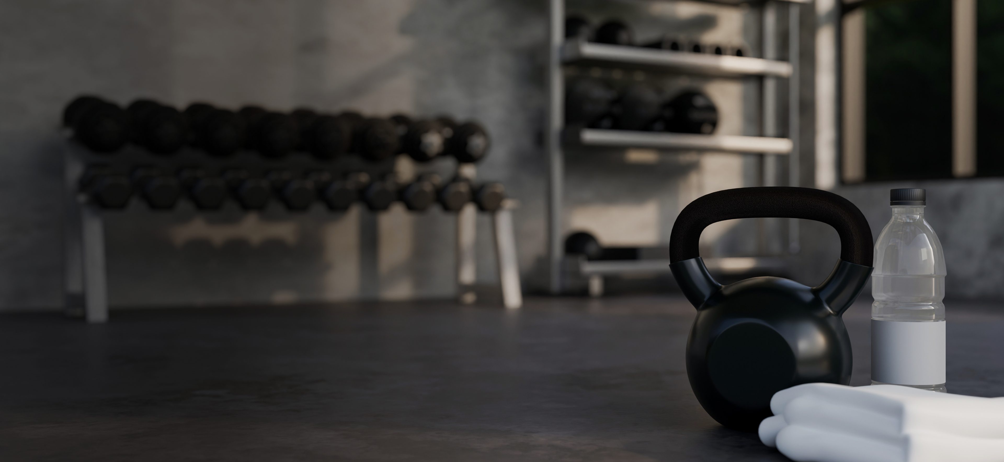 Gym equipment with kettlebell and dumbbells.