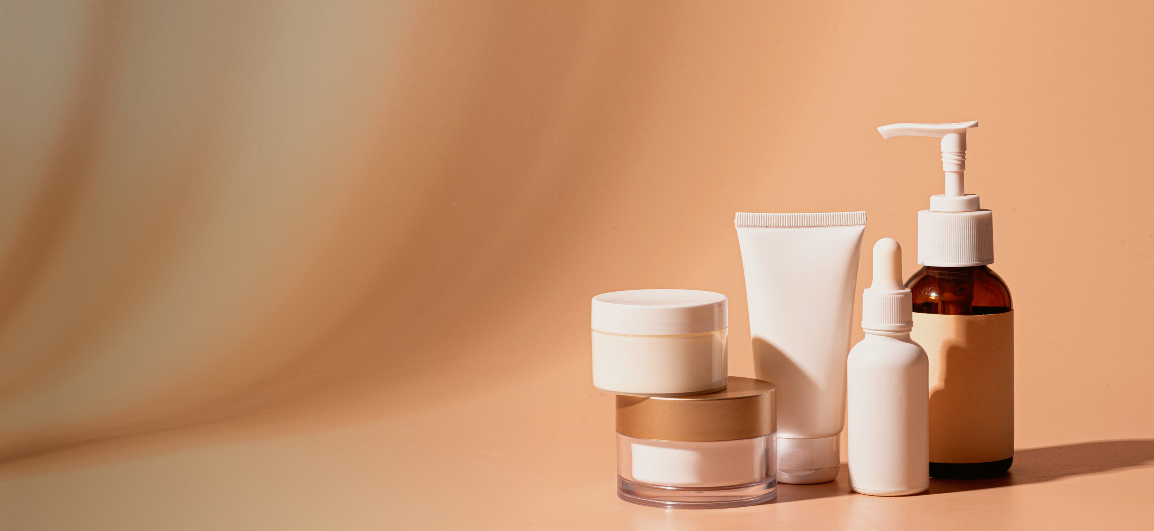 Skincare products on a beige background.